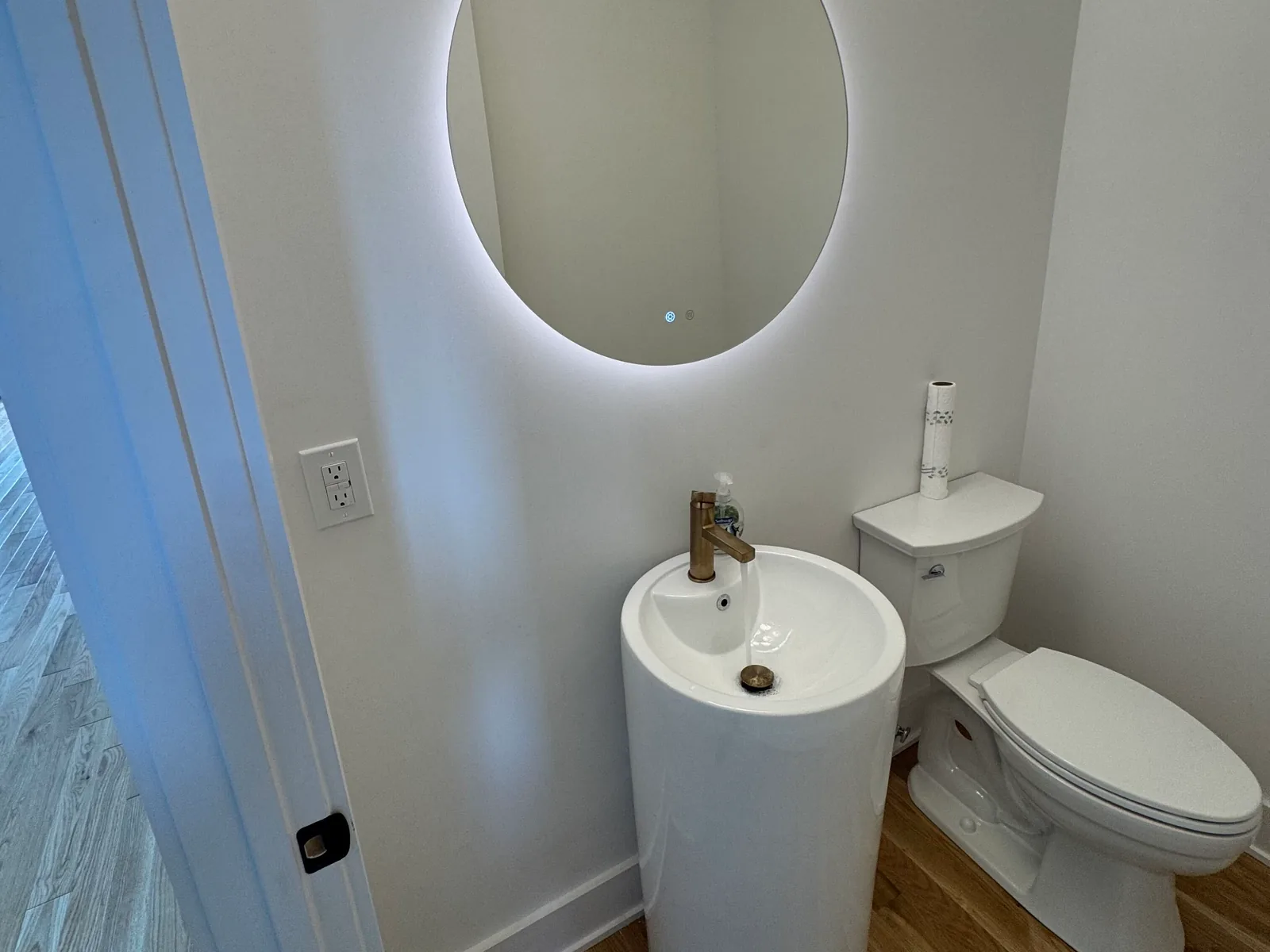 Toilet and pedestal sink in a powder room, toilet repair