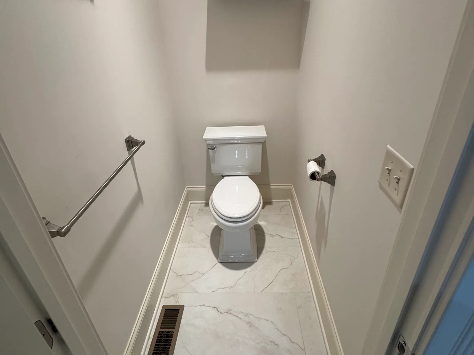 Toilet in a small tiled toilet room, toilet repair