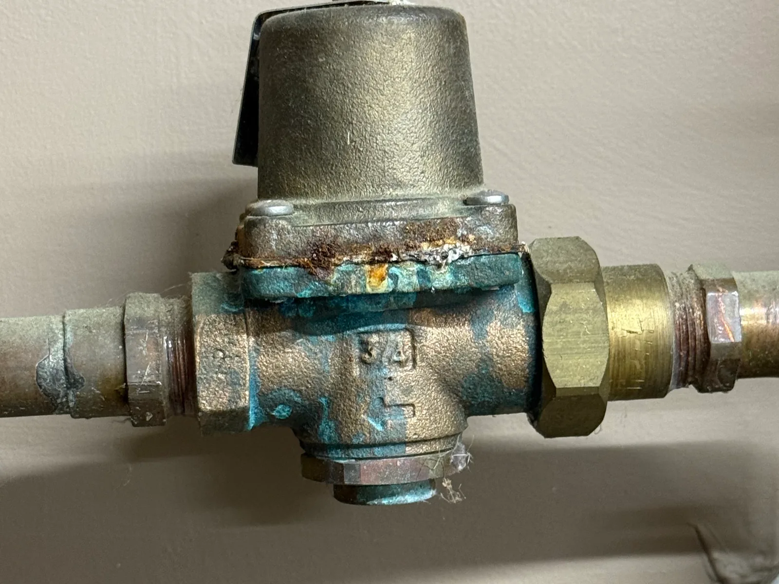 Corroded pressure regulating valve on a water line, water line repair